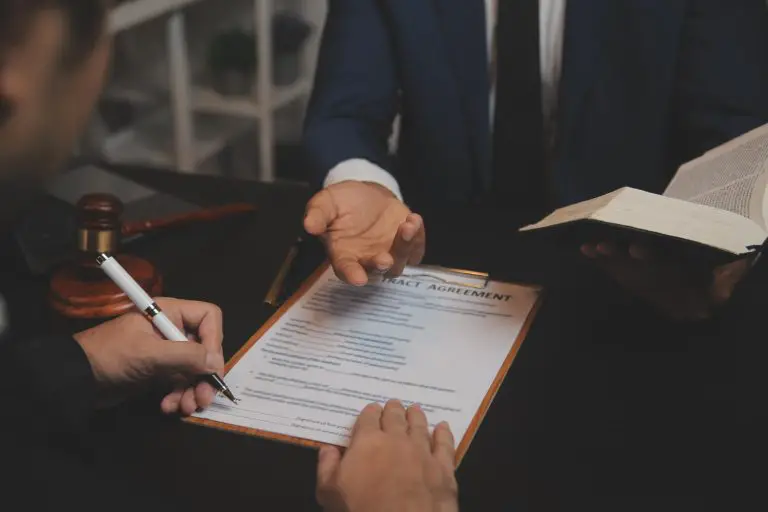 business-lawyers-discussing-contract-papers-with-brass-scale-desk-office-law-legal-services-advice-justice-law-concept-picture-with-film-grain-effect